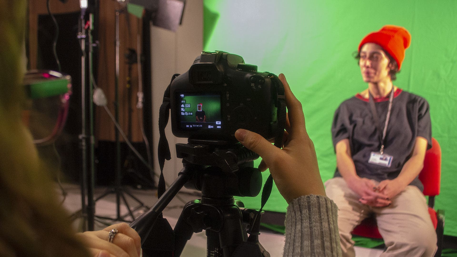 Ӱֱ Creative Media student filming on green screen